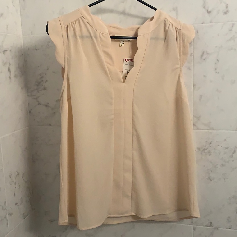 Cream colored sleeveless top